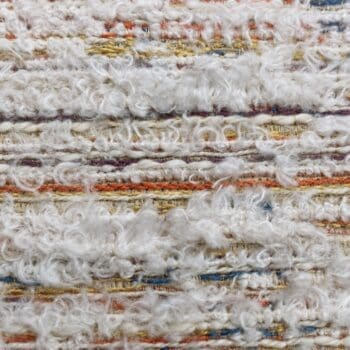 Lichte geweven meubelstof met zachte lusstructuur en subtiele kleuraccenten. Geschikt voor banken, fauteuils en sierkussens. Martindale 28.000.